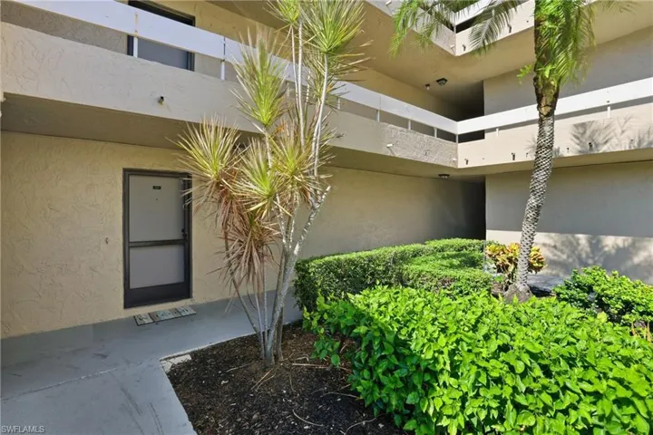 Entrance to property featuring stucco siding