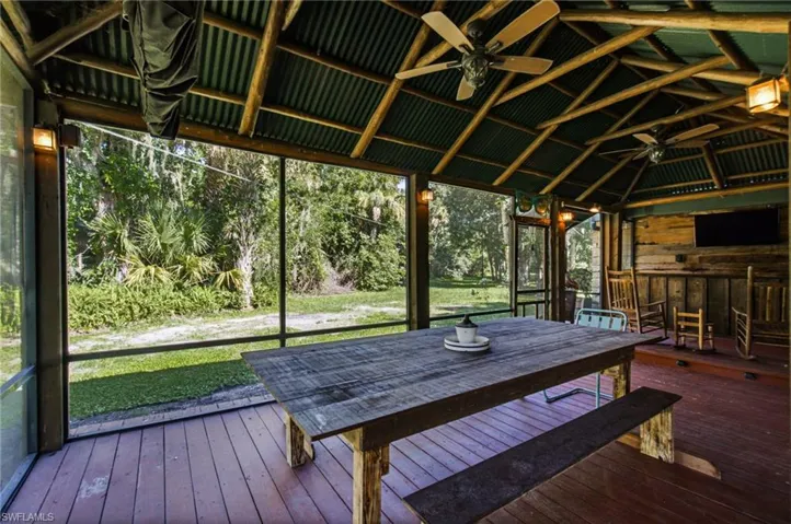 Screened portion of the covered outdoor living area with viewable of the property