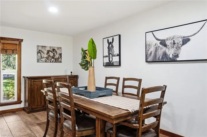 dedicated dining space located adjacent to the kitchen