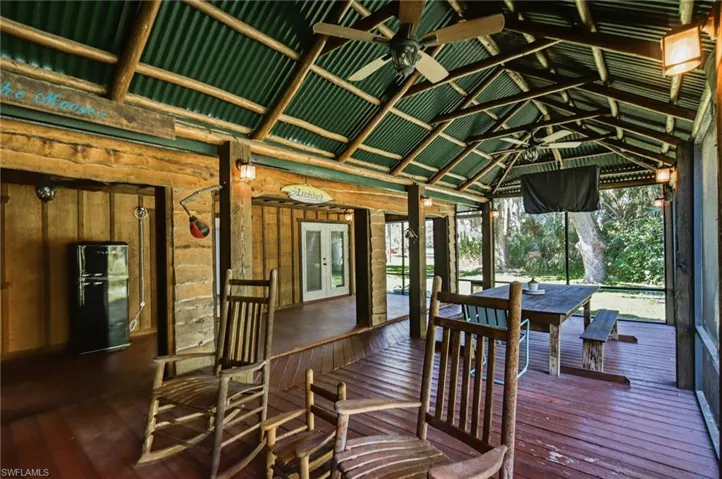 Additional view of the covered outdoor area overlooking the surrounding property