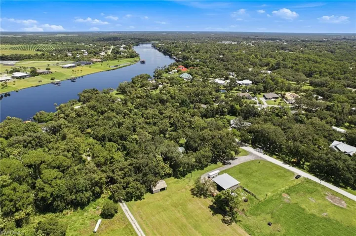 Aerial view highlighting the open grounds surrounding the residence