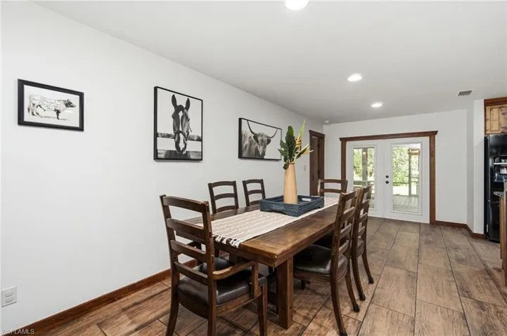 Additional view of the dining area with access to the surrounding living spaces
