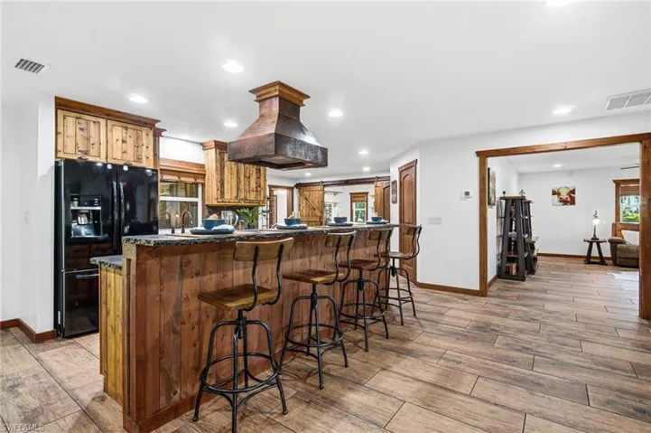 Center island with bar seating and additional workspace