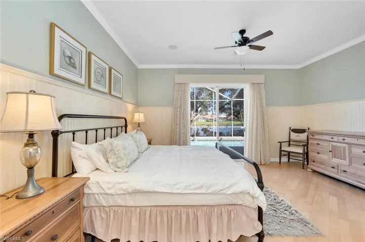 Primary Bedroom overlooking pool and lake