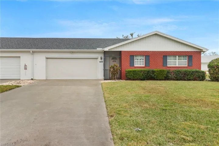 Lovely attached villa with 2-car garage and ample parking area