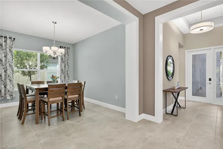 People love this separate, more formal dining room! Custom millwork framed entry!