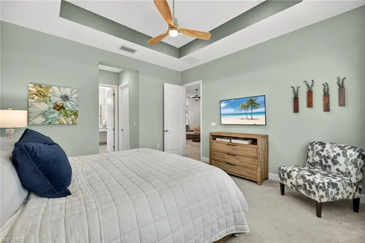 Tray ceiling and upgraded ceiling fan present here!