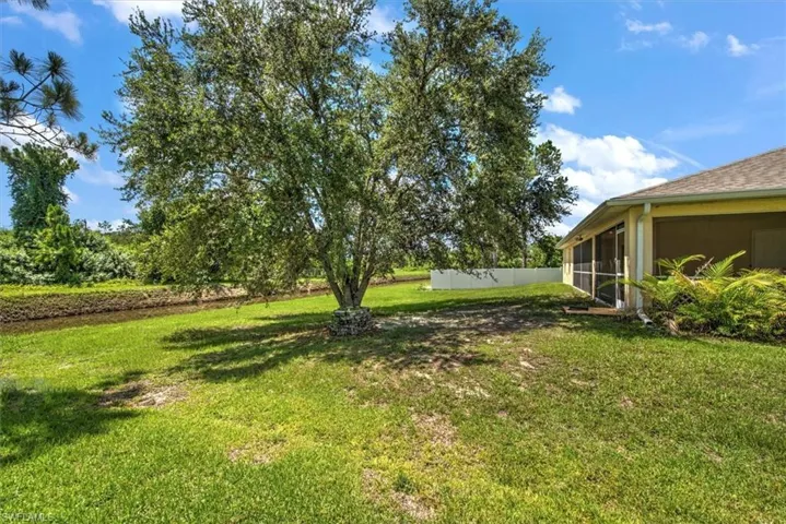 View of yard featuring a sunroom