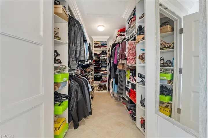 Spacious closet with tile patterned floors