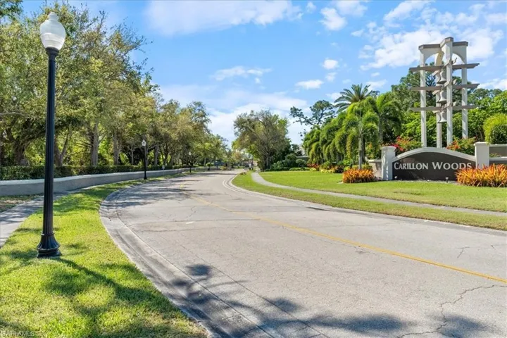 View of street with sidewalks, curbs, and street lights