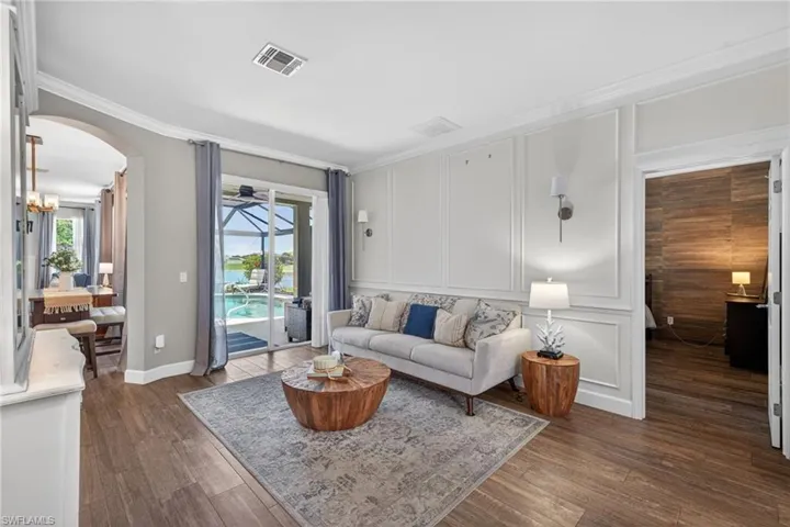 Formal Living Room with Floor to Ceiling Wood Paneling