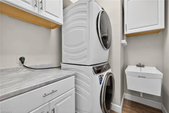 Renovated Laundry with Front Load Washer and Dryer