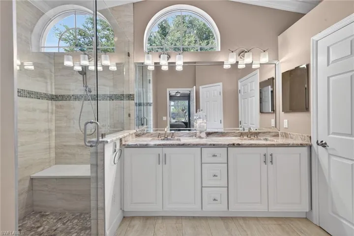 Primary Bath with Renovated Dual Vanities and an arched window