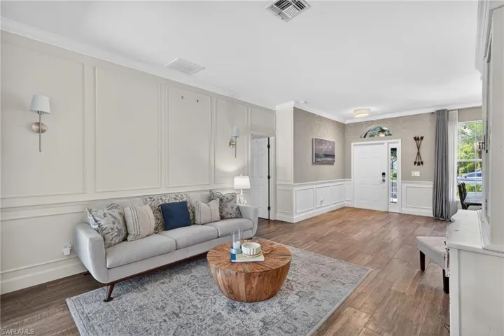Formal Living Room with Floor to Ceiling Wood