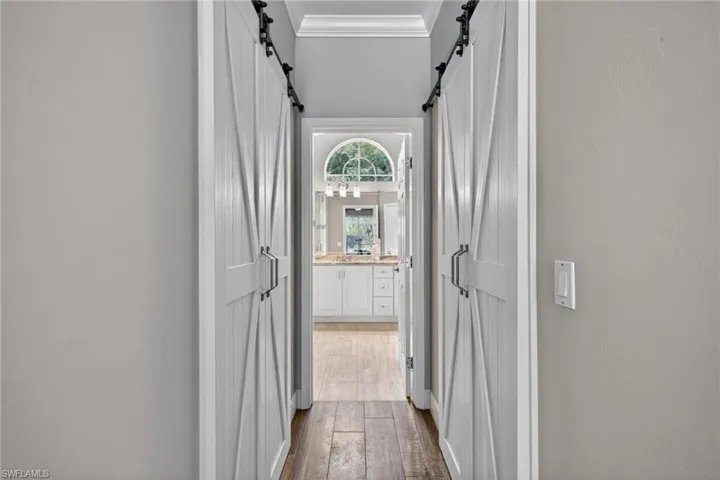 Primary Bed 2 walk in closets with barn doors