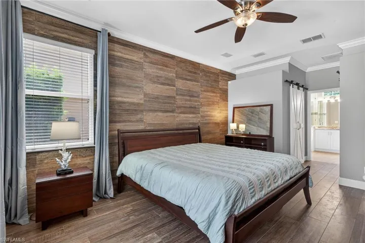 Primary Bed with Wood Plank Tile Floors