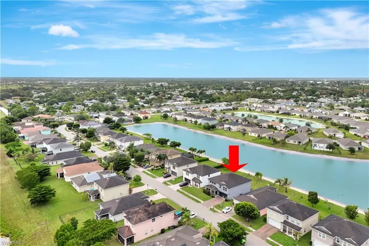Aerial view of residential area with a large body of water