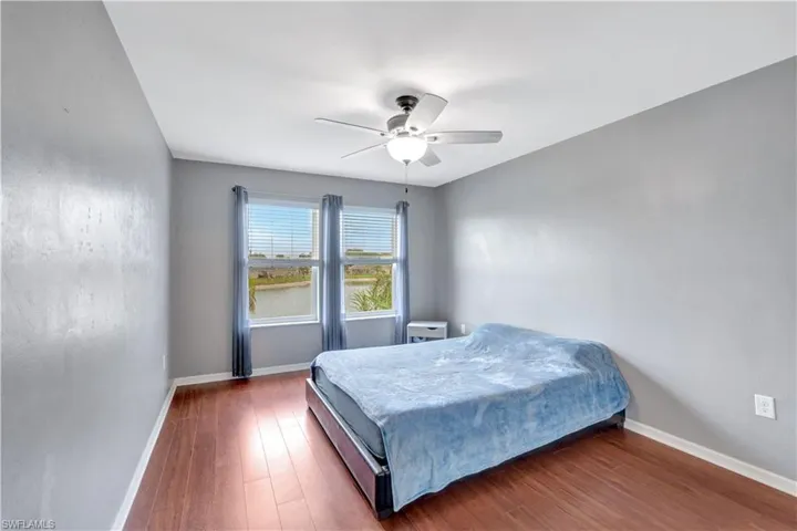 Bedroom with wood finished floors and a ceiling fan