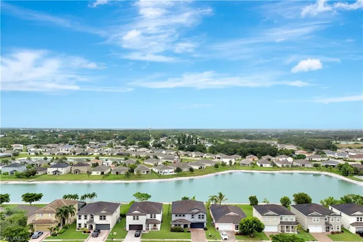 Aerial perspective of suburban area with a large body of water