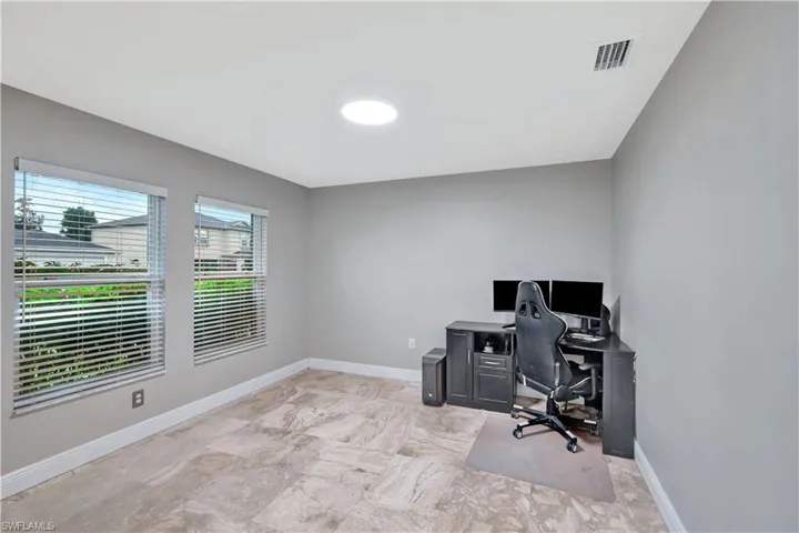 Office area featuring baseboards