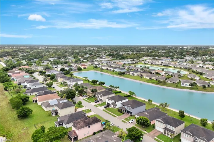 Aerial perspective of suburban area with a nearby body of water