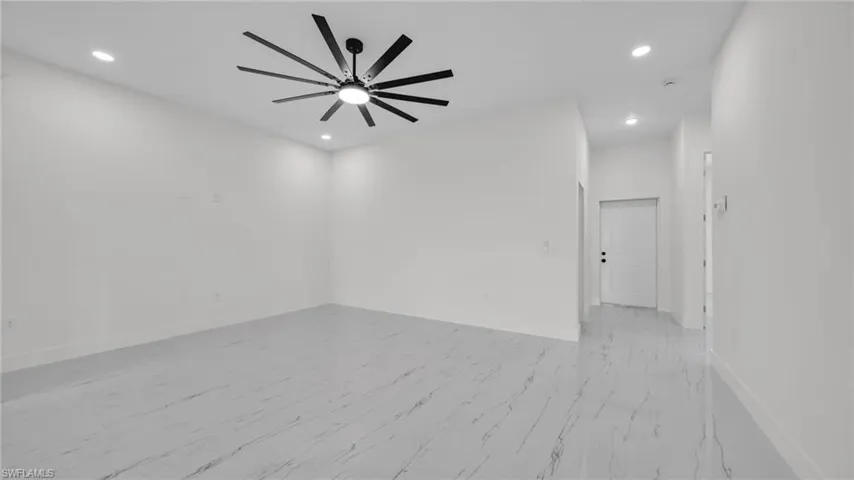 Unfurnished room with recessed lighting and ceiling fan