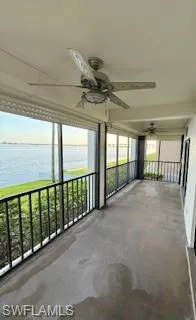 Unfurnished sunroom featuring a water view