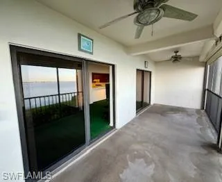 Unfurnished sunroom featuring plenty of natural light and a water view