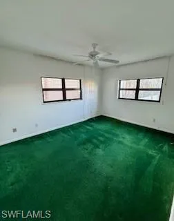 Unfurnished  Master bedroom featuring carpet and ceiling fan