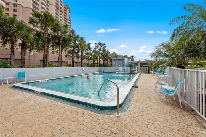 Community pool featuring a patio area