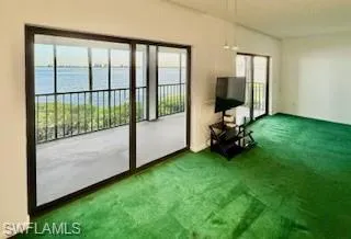 Doorway to outside featuring carpet floors