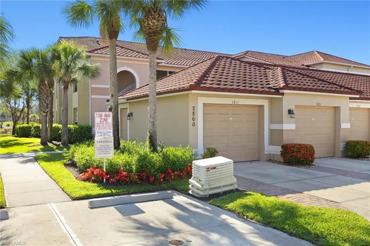 Cypress Trace corner unit condo with detached garage
