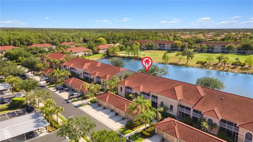 Birds eye view of property featuring a water view and view of golf course