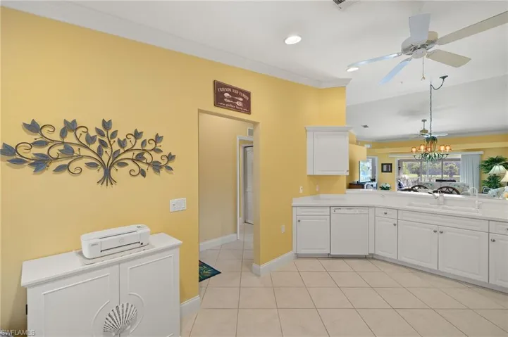 Kitchen flows into dining and living room.