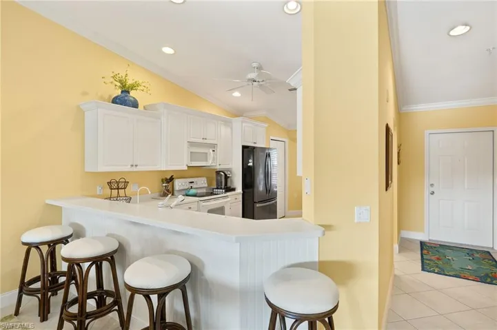 It's in the details! Wainscoting adds additional charm to the counter bar.
