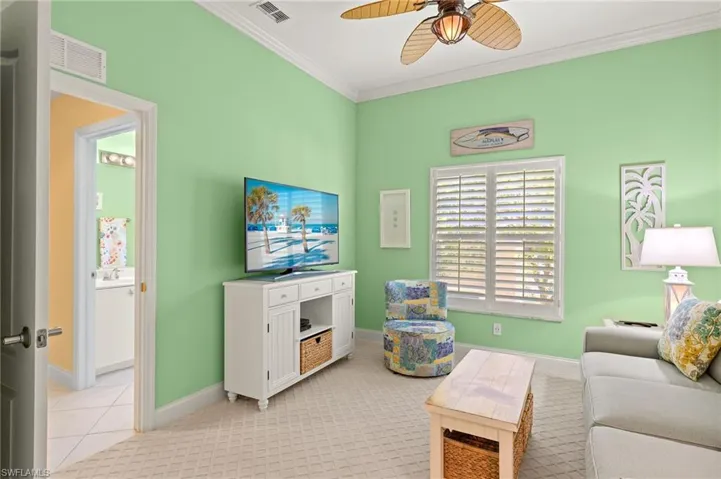 Den with hall door for additional privacy as  a guest suite.