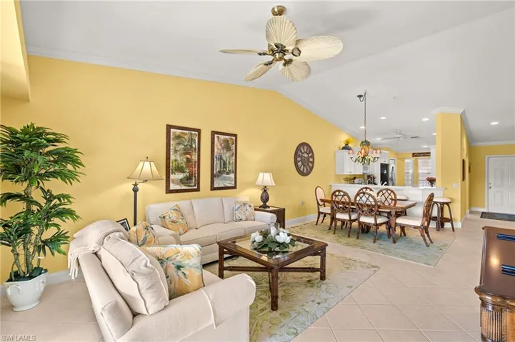 Inviting 2nd floor condo with vaulted ceilings and corner unit windows.