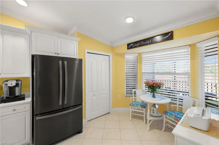 More views of the kitchen modern refrigerator and pantry.