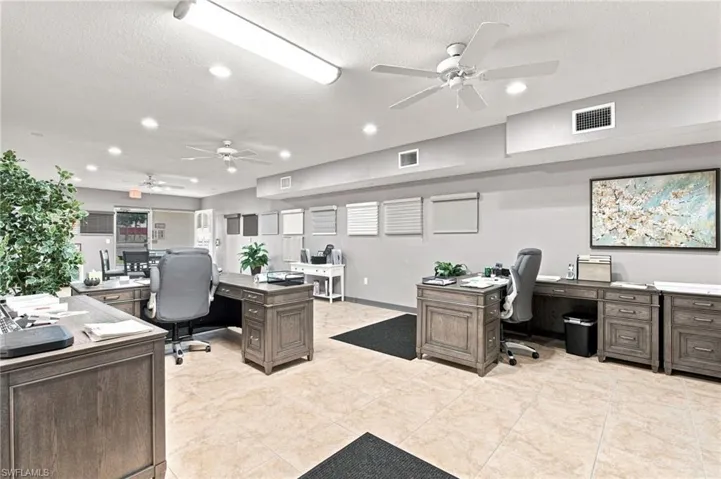 Recessed lighting, ceiling fans, tile flooring, and neutral wall tones