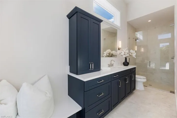 En suite bathroom 4 with secondary direct pool deck access