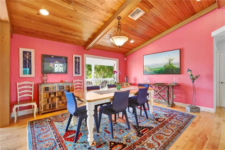 Dining area featuring light wood finished floors and wood ceiling