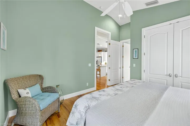 Bedroom with wood finished floors, a closet, and a ceiling fan