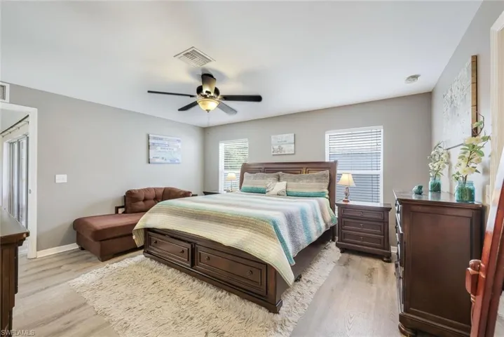 Bedroom featuring light hardwood / wood-style flooring and ceiling fan