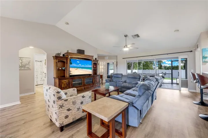 Great Room with vaulted ceiling and luxury wood plank vinyl flooring.