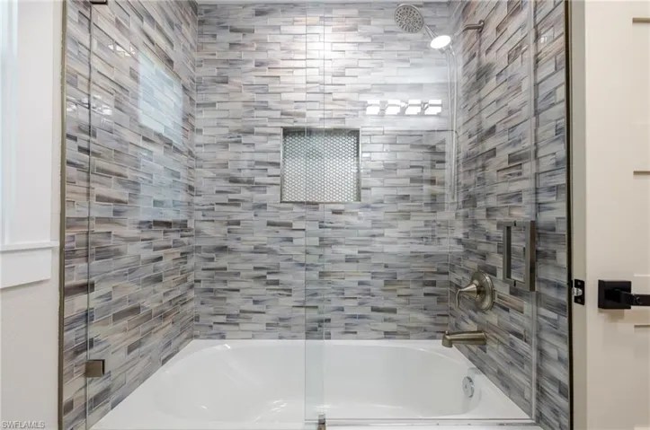 Full bath featuring enclosed tub / shower combo