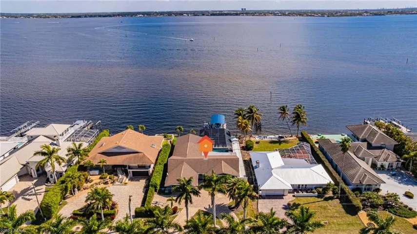Aerial perspective of suburban area with a nearby body of water