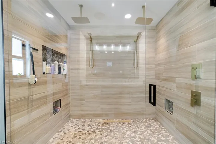 Full bath with a shower stall