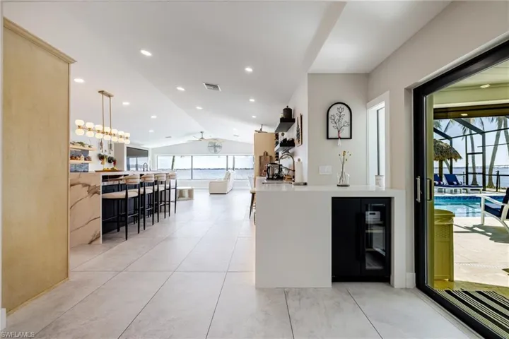 Kitchen with pendant lighting, a breakfast bar, and ceiling fan