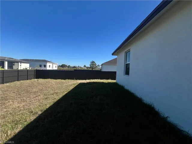 View of fenced backyard