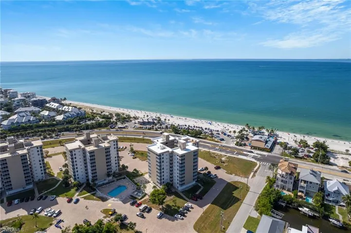 Drone / aerial view of waterfront with a beach